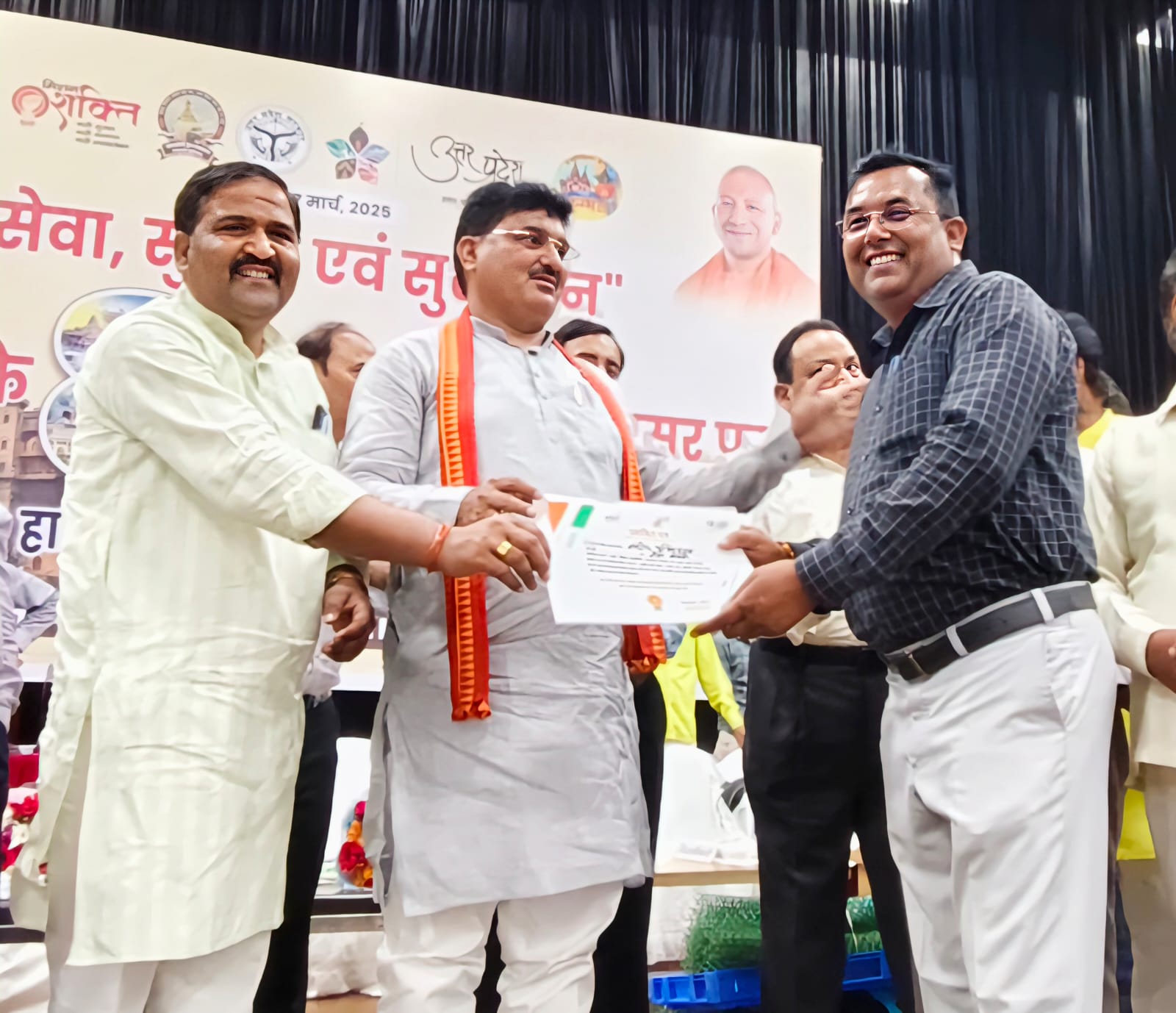 Receiving certificate at UP government event
